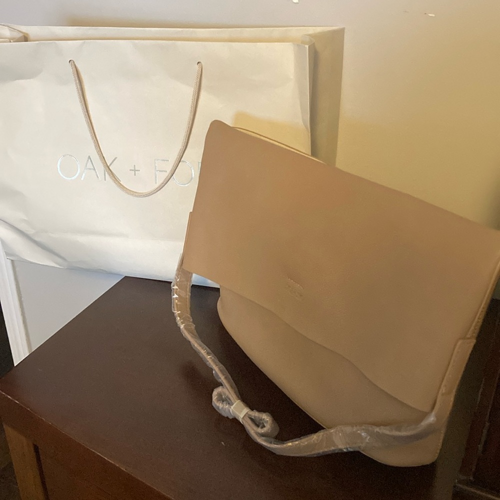 Brand new still with wrapping. Oak and Fort purse soft leather tan colour
